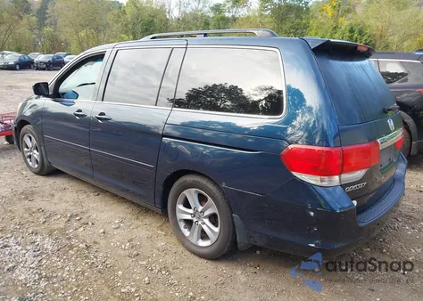 2010 Honda Odyssey Touring z USA, uszkodzony, nr VIN 5FNRL3H99AB058887
